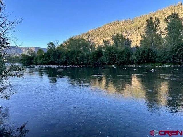 a view of a lake with a mountain in the background