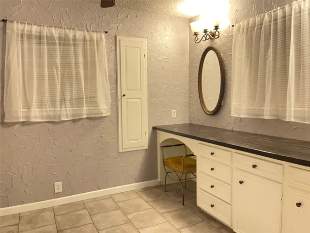 a bathroom with a sink a mirror and a shower