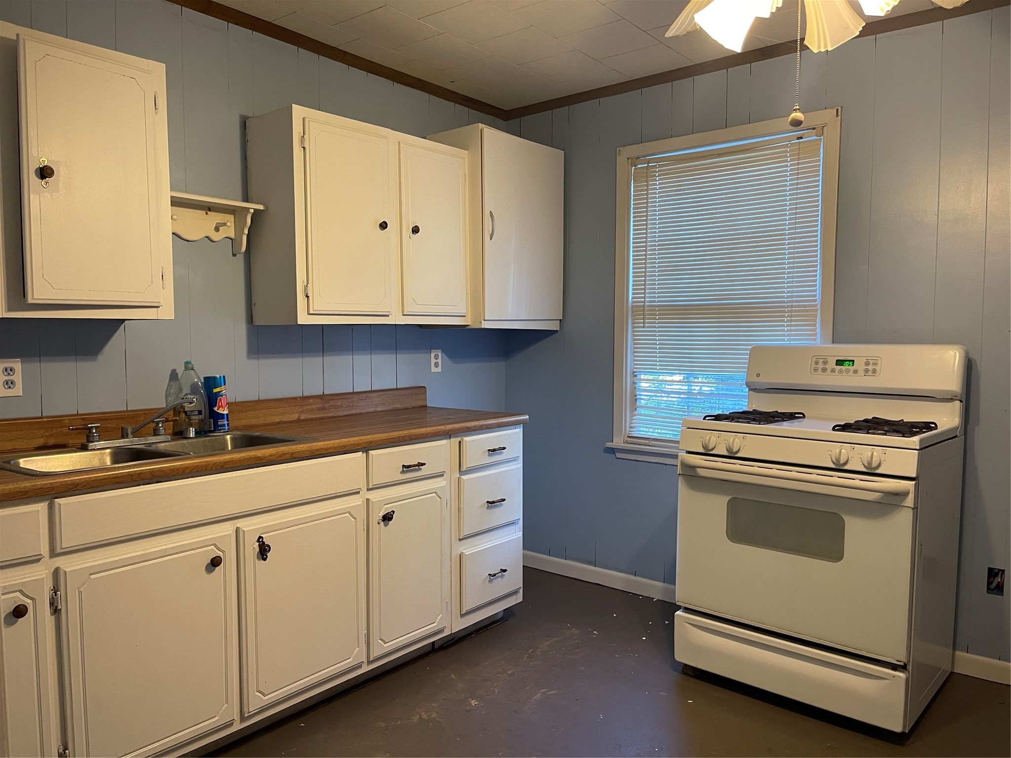 255 Frank Street, Unit AB Kountze, TX 77625 - Photo 24 of 33 a kitchen with granite countertop white cabinets and white appliances
