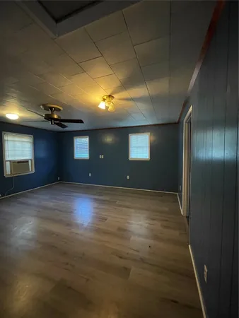 a view of an empty room with a chandelier