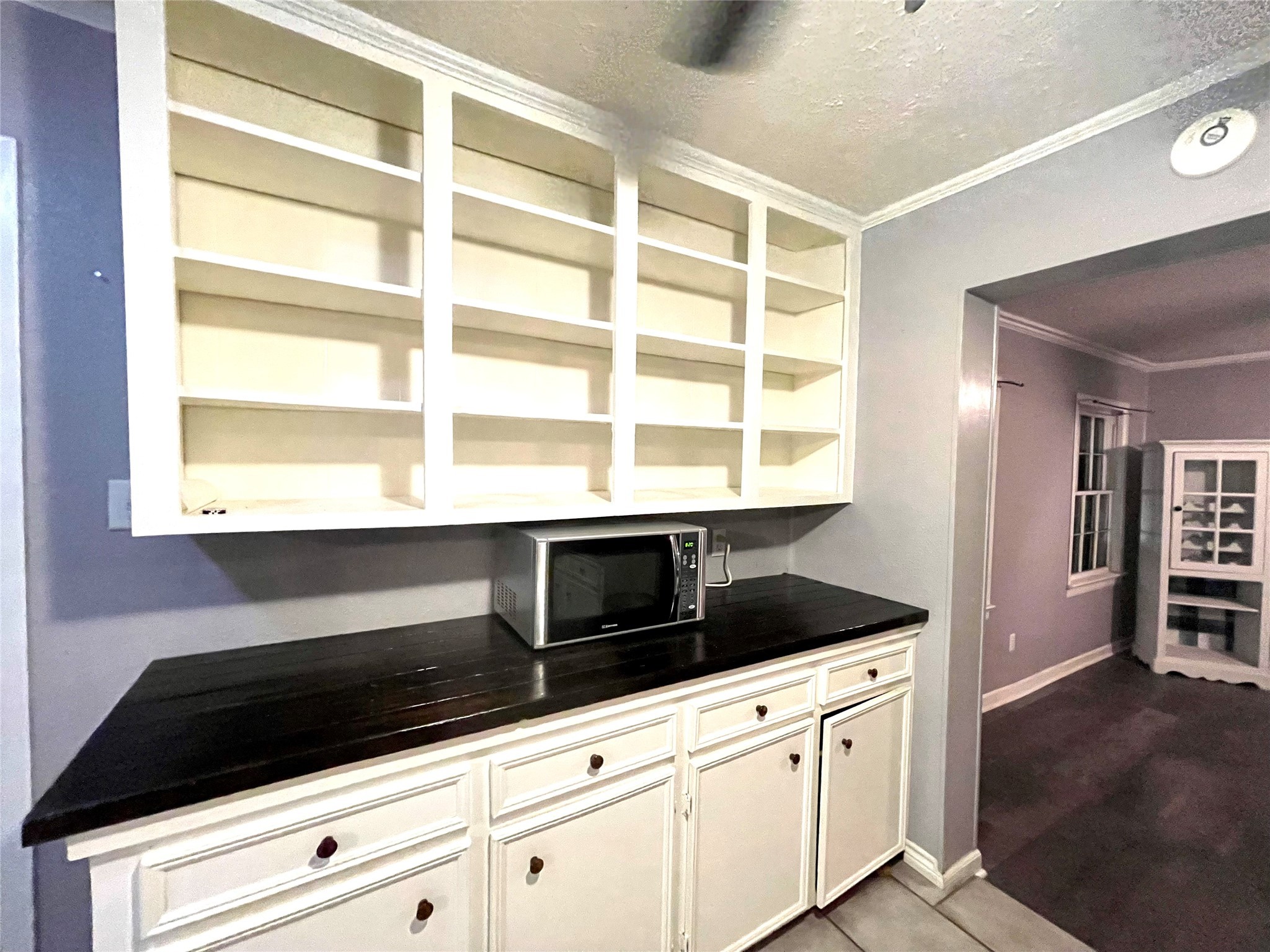 255 Frank Street, Unit AB Kountze, TX 77625 - Photo 4 of 33 a kitchen with granite countertop cabinets and window