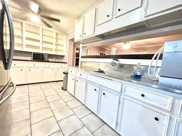 a kitchen with appliances cabinets and a counter top