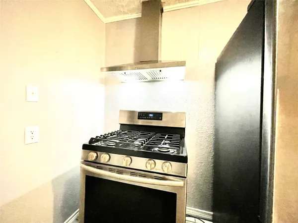 a kitchen with a stove and a microwave