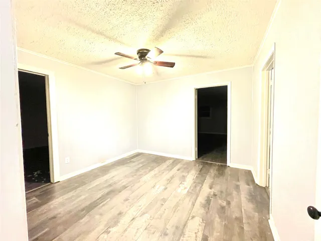 a view of a big room with wooden floor