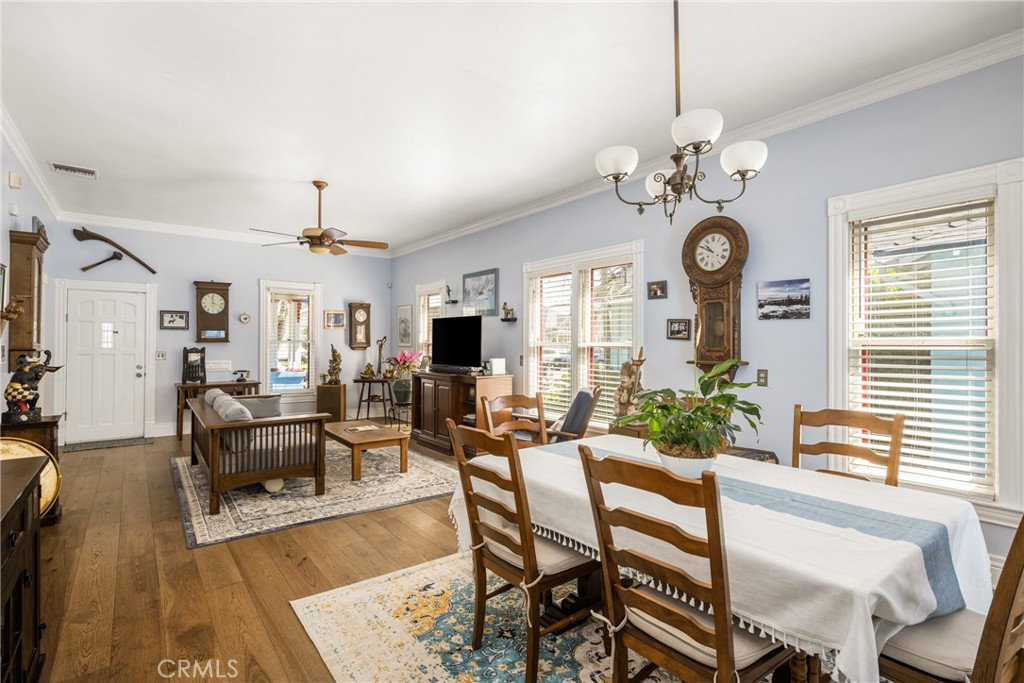 358 North Shaffer Street Orange, CA 92866 - Photo 12 of 45 a view of a dining room with furniture a chandelier and wooden floor