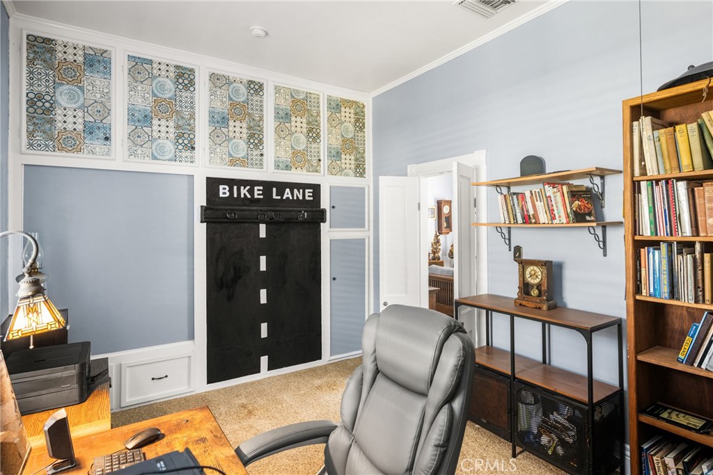 358 North Shaffer Street Orange, CA 92866 - Photo 22 of 45 a living room with furniture a bookshelf and a window