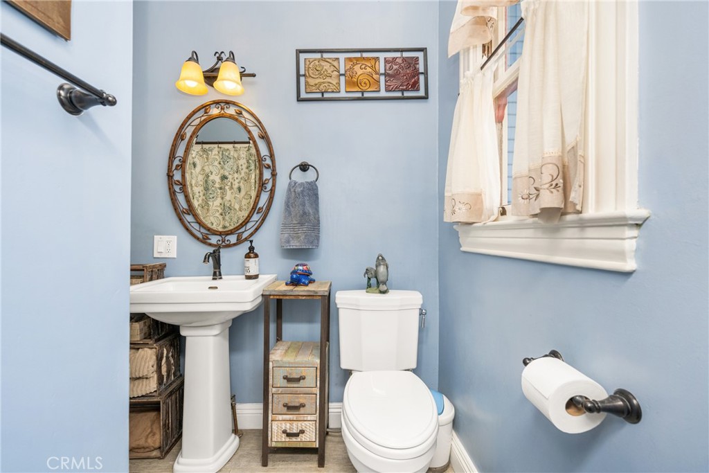 358 North Shaffer Street Orange, CA 92866 - Photo 23 of 45 a bathroom with a toilet a sink and a window