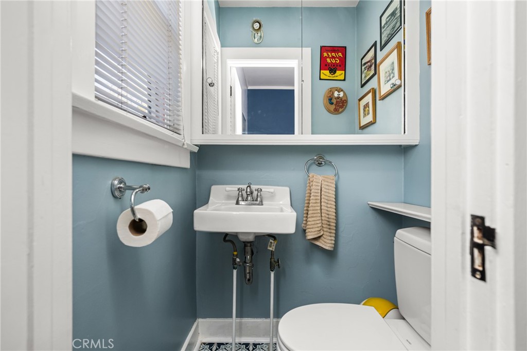 358 North Shaffer Street Orange, CA 92866 - Photo 33 of 45 a bathroom with a sink a toilet and shower