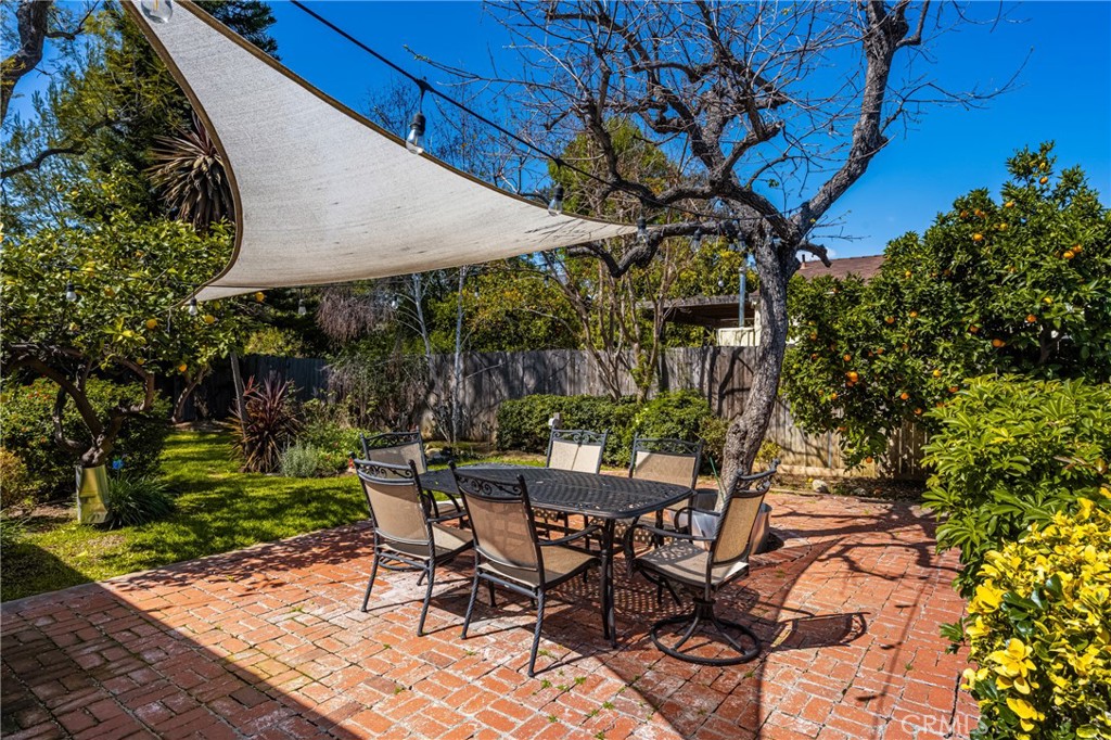 358 North Shaffer Street Orange, CA 92866 - Photo 35 of 45 a view of a patio with table and chairs under an umbrella