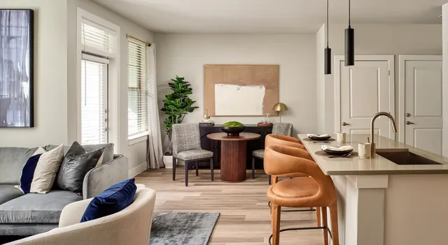 a living room with fireplace furniture and a wooden floor