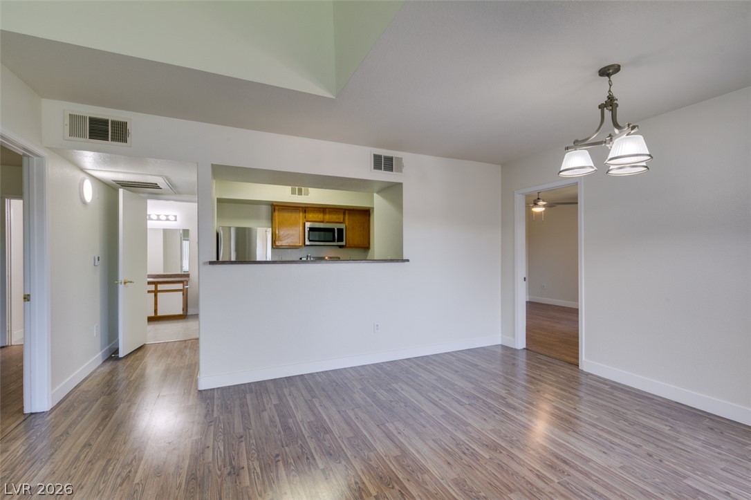6650 West Warm Springs Road, Unit 2118 Las Vegas, NV 89118 - Photo 15 of 41 An open-concept living space with sleek flooring connects to a well-appointed kitchen.