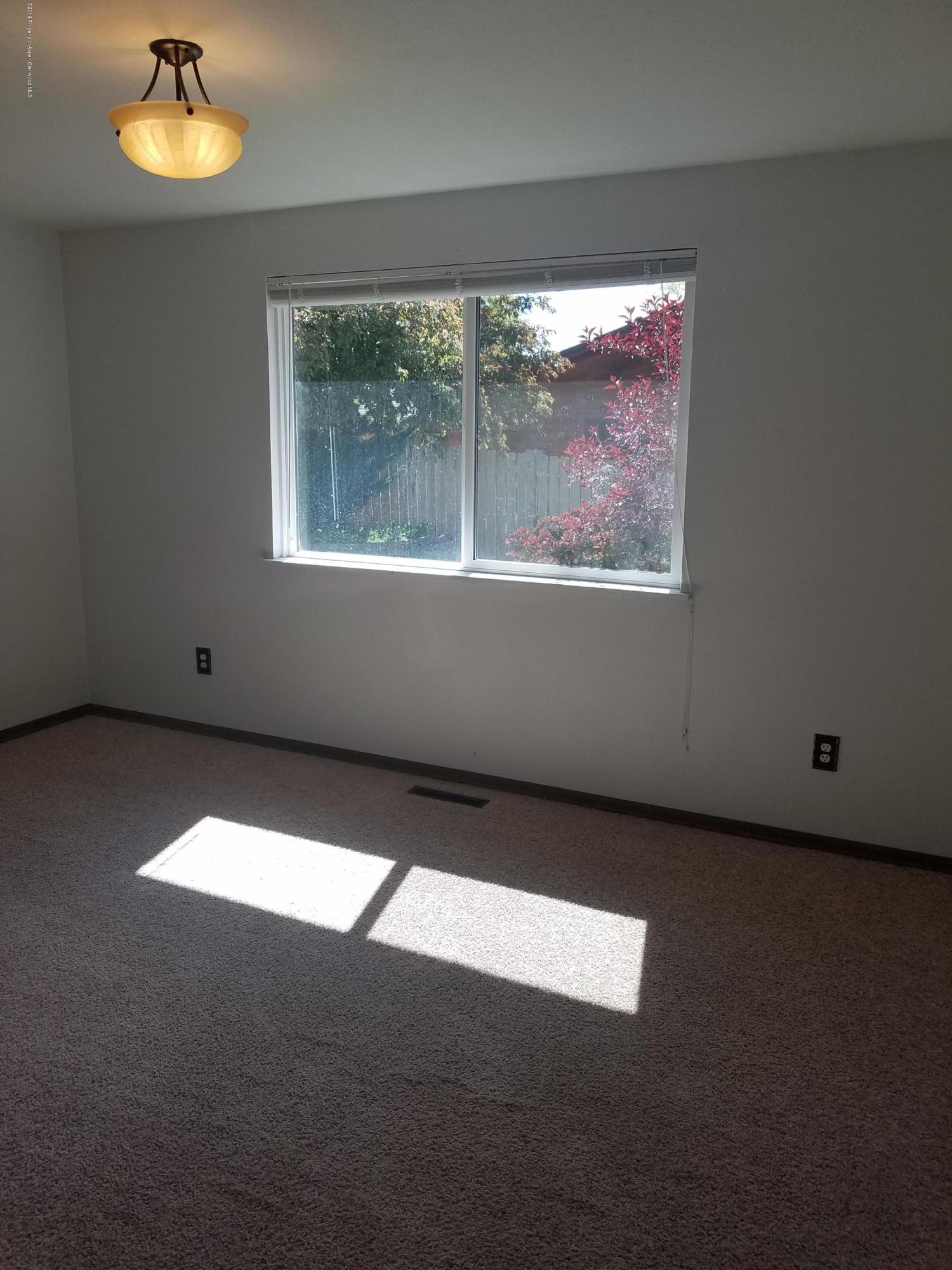 1436 Jays Avenue Rifle, CO 81650 - Photo 15 of 20 a view of an empty room with a window