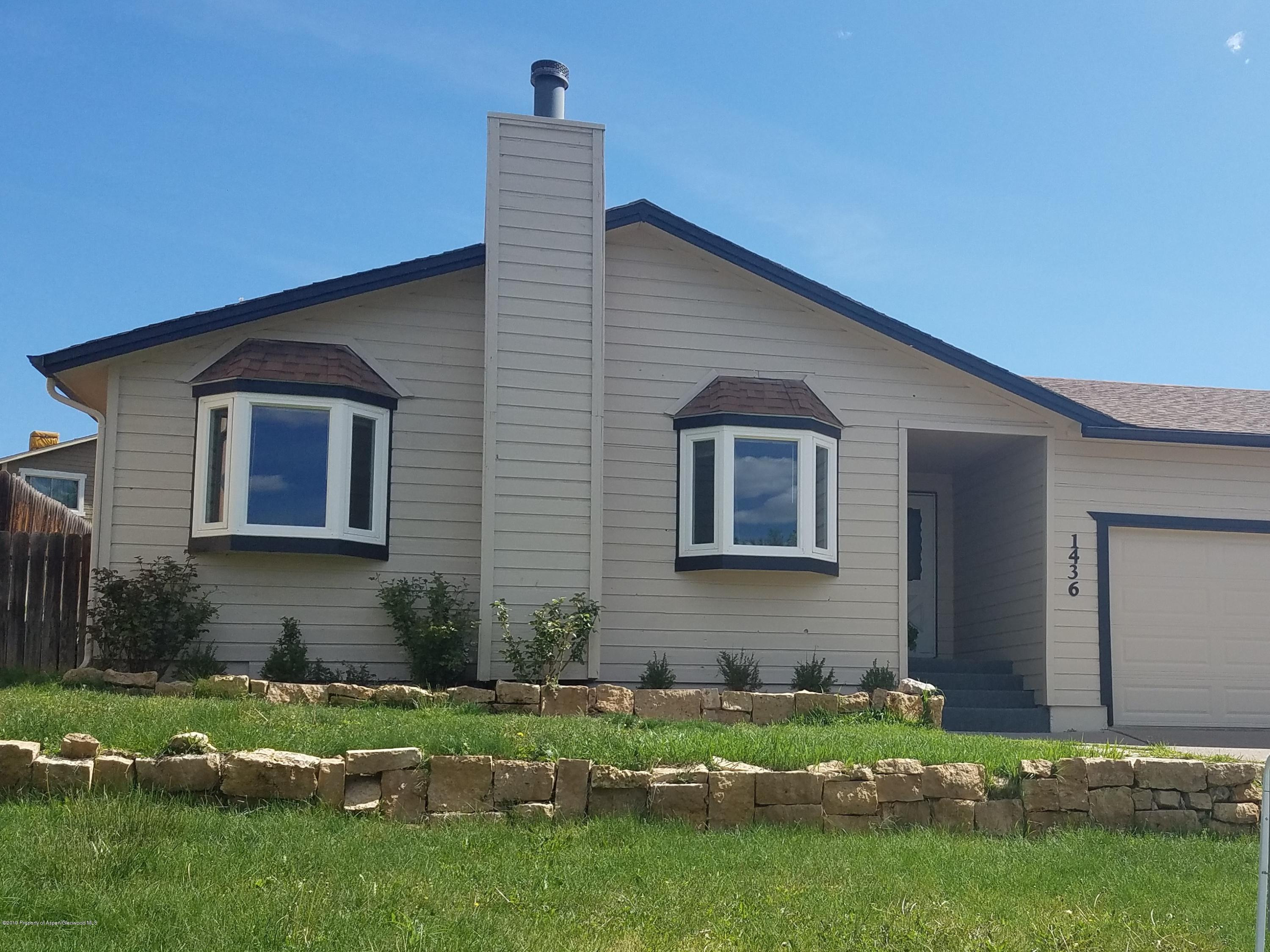 1436 Jays Avenue Rifle, CO 81650 - Photo 2 of 20 a front view of a house with a yard