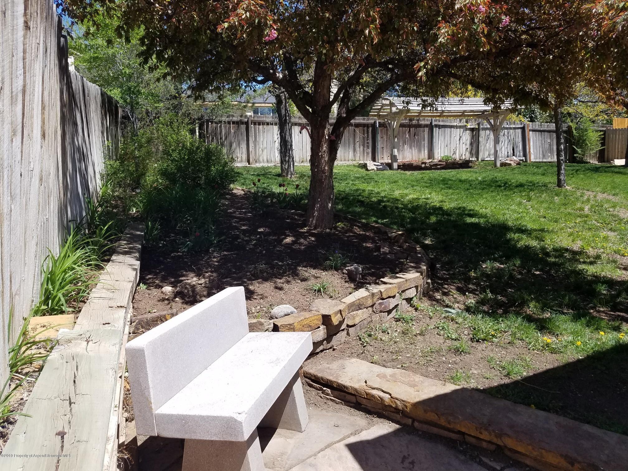 1436 Jays Avenue Rifle, CO 81650 - Photo 5 of 20 a view of yard with green space and seating area