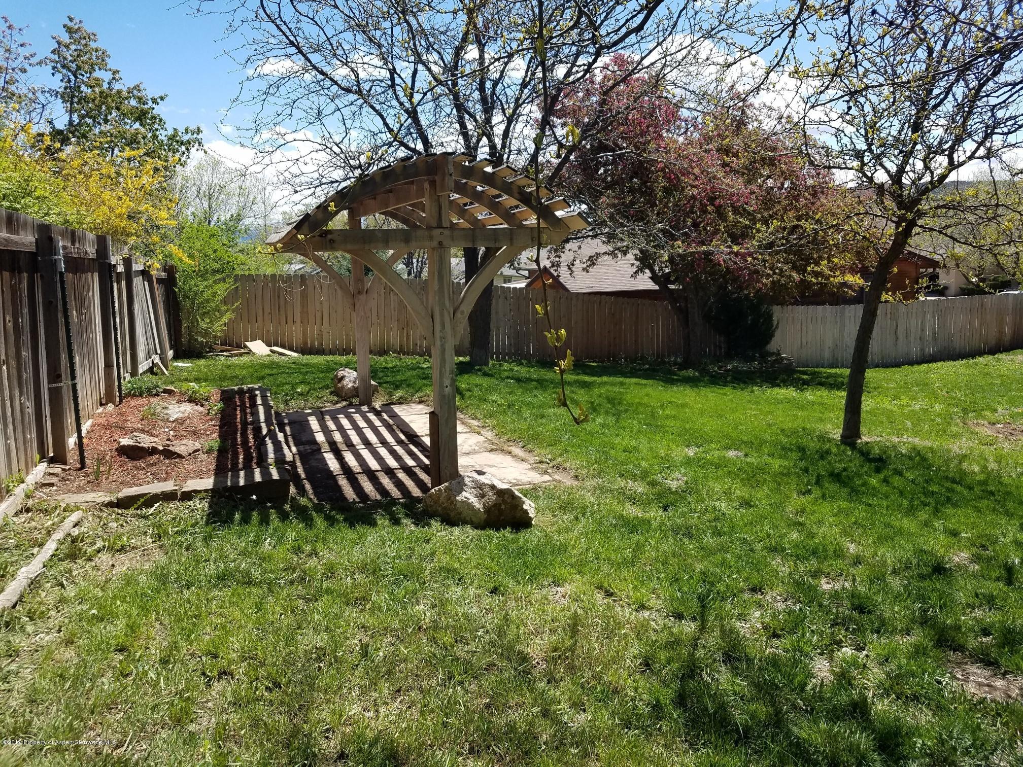 1436 Jays Avenue Rifle, CO 81650 - Photo 6 of 20 a view of a backyard with a slide