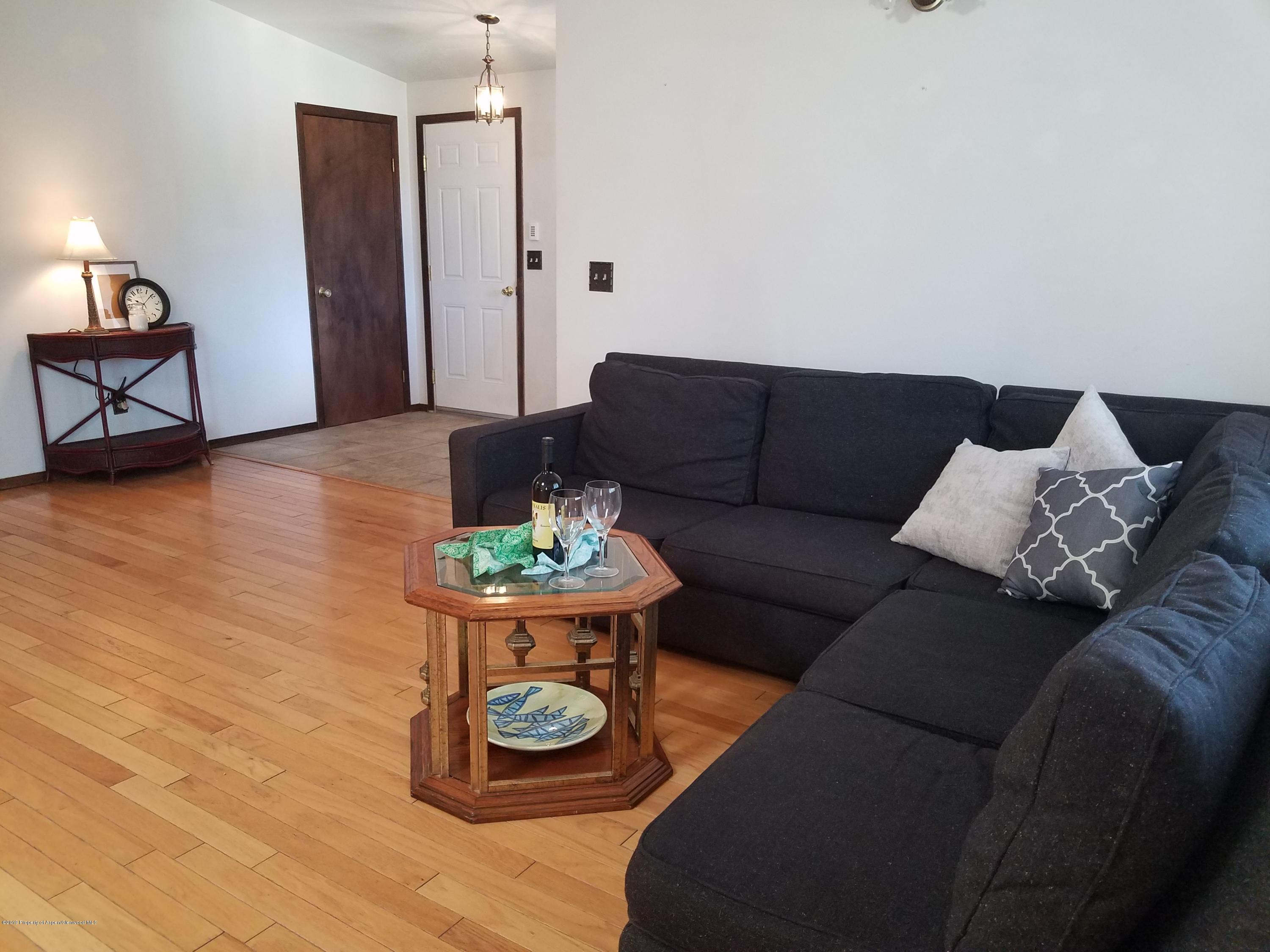 1436 Jays Avenue Rifle, CO 81650 - Photo 9 of 20 a living room with furniture and wooden floor