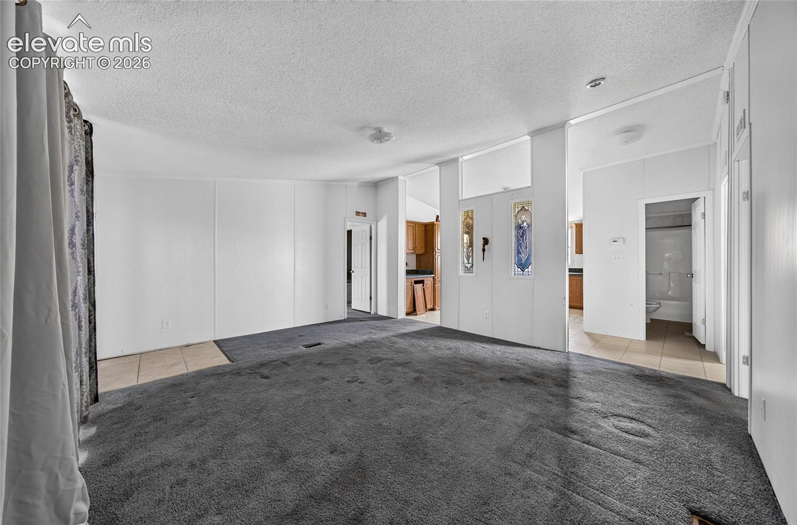 41751 Harbour Road Avondale, CO 81022 - Photo 5 of 41 Open-concept living area with carpeting