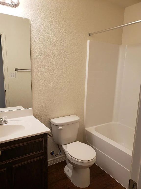 895 Twin Oaks Drive, Unit B Temple, TX 76504 - Photo 6 of 11 a bathroom with a sink a toilet and shower