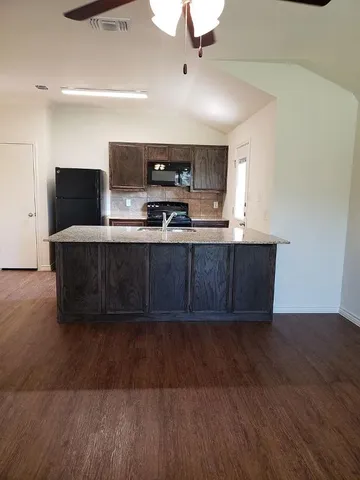 a view of kitchen with wooden floor