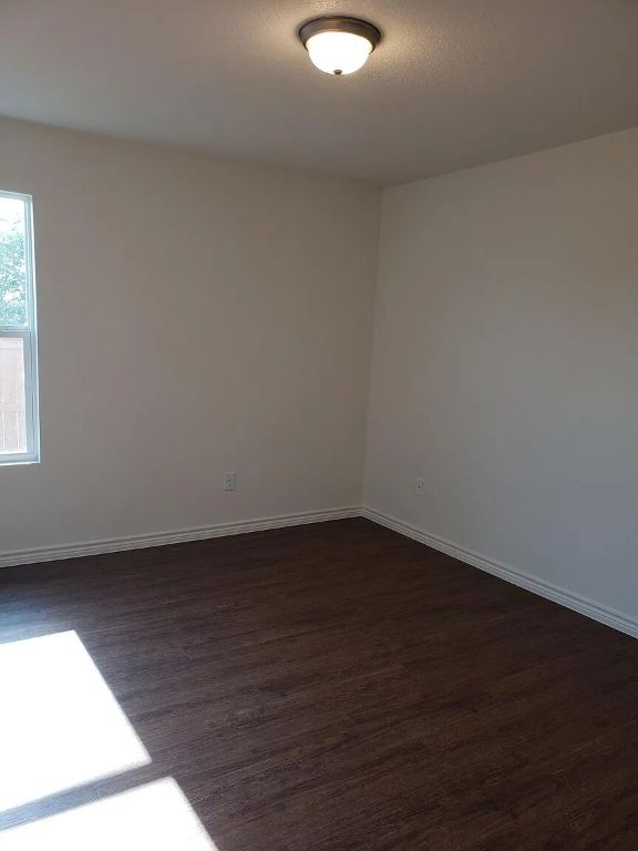 895 Twin Oaks Drive, Unit B Temple, TX 76504 - Photo 10 of 11 a view of an empty room and window