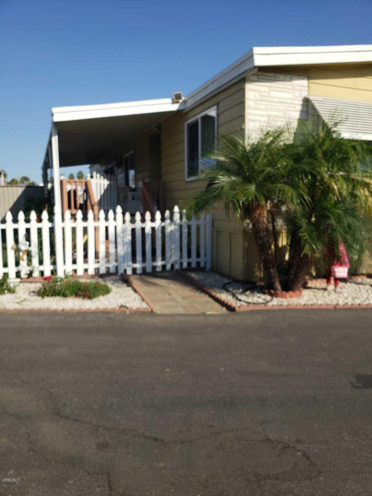 2400 East Pleasant Valley Road, Unit 152 Oxnard, CA 93033 - Photo 2 of 12 a view of a house with a street