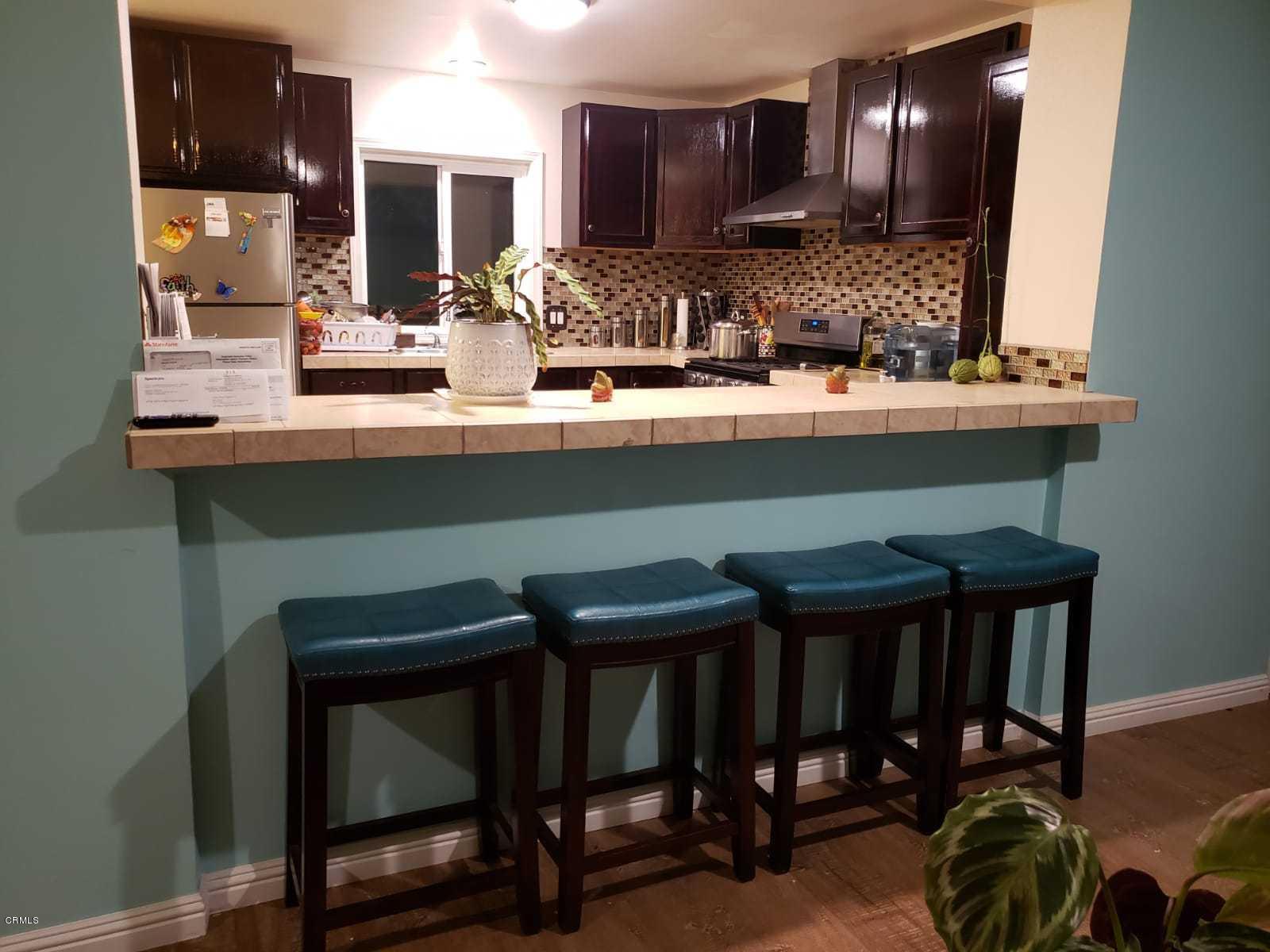 2400 East Pleasant Valley Road, Unit 152 Oxnard, CA 93033 - Photo 6 of 12 a kitchen with a sink cabinets and window