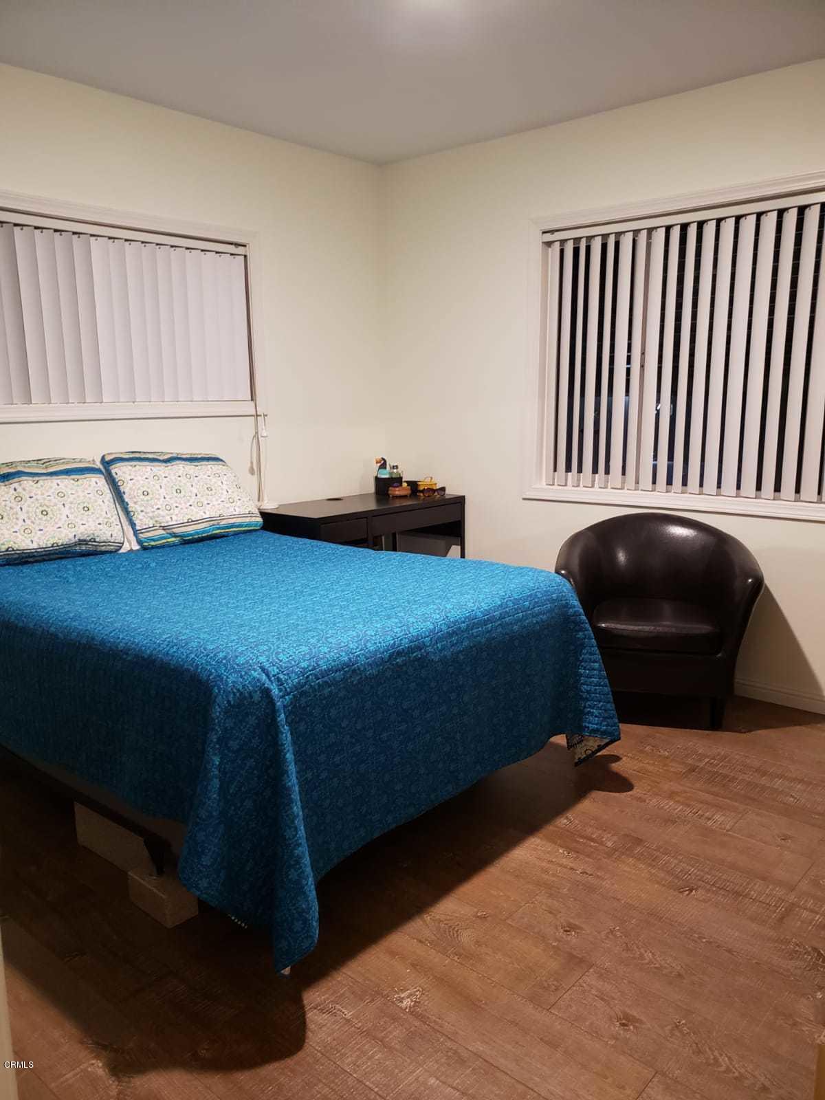 2400 East Pleasant Valley Road, Unit 152 Oxnard, CA 93033 - Photo 9 of 12 a bedroom with a bed and window