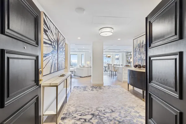 a kitchen with a refrigerator and a sink