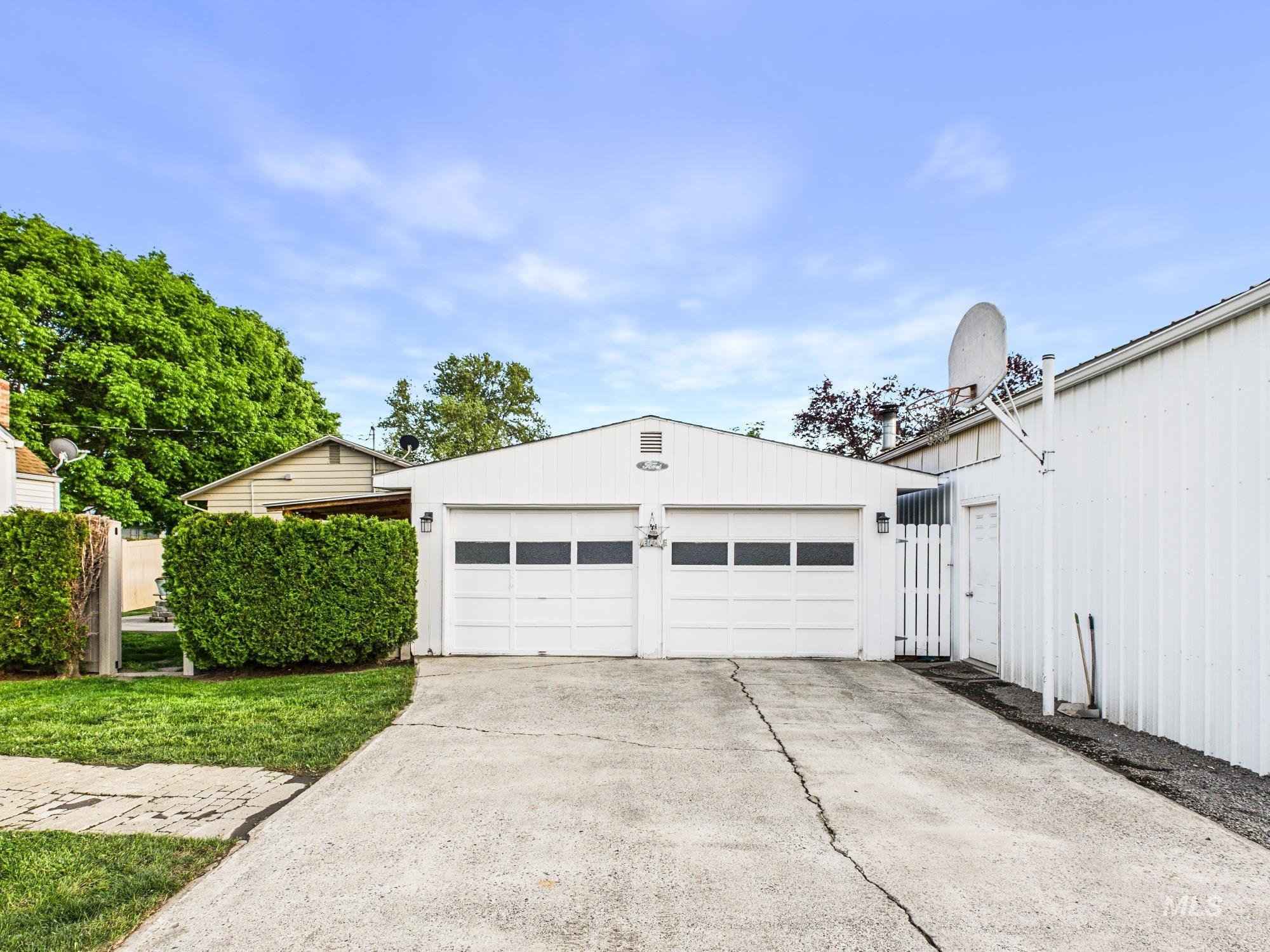 3422 6th Street Lewiston, ID 83501 - Photo 5 of 43 Two-car garage with white paneled doors and transom windows