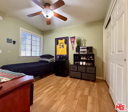 a bed room with a bed and a window