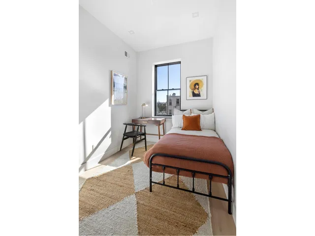 a bathroom with a toilet a sink and a mirror