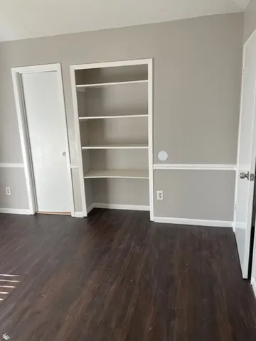 a view of a room with rack and wooden floor