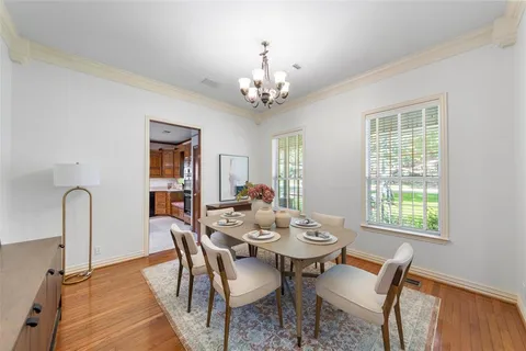 a view of a dining room with furniture and window