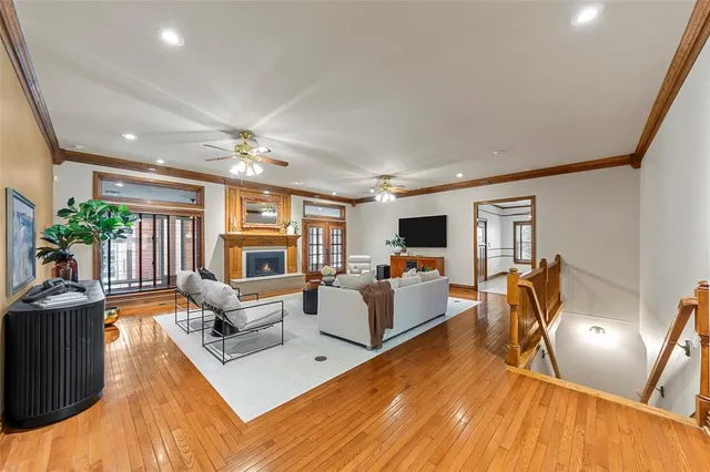 a living room with furniture fireplace and flat screen tv