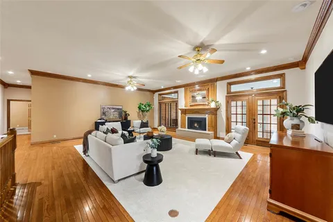 a living room with furniture fireplace and flat screen tv