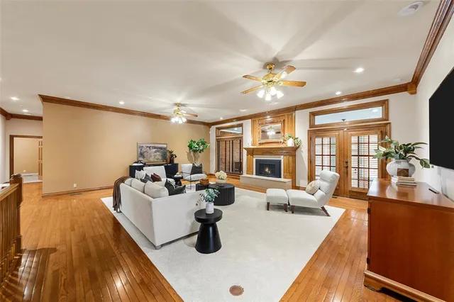 a living room with furniture fireplace and flat screen tv