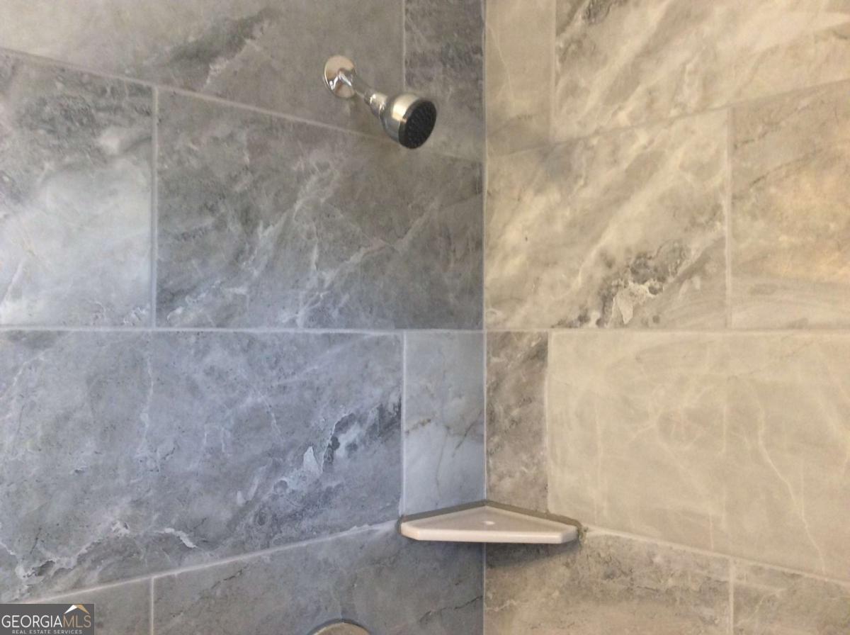 209 Decatur Road McDonough, GA 30253 - Photo 13 of 25 a bathroom with a shower