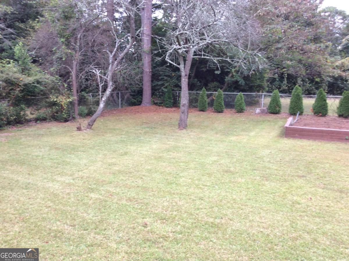 209 Decatur Road McDonough, GA 30253 - Photo 23 of 25 a view of a yard with basketball court
