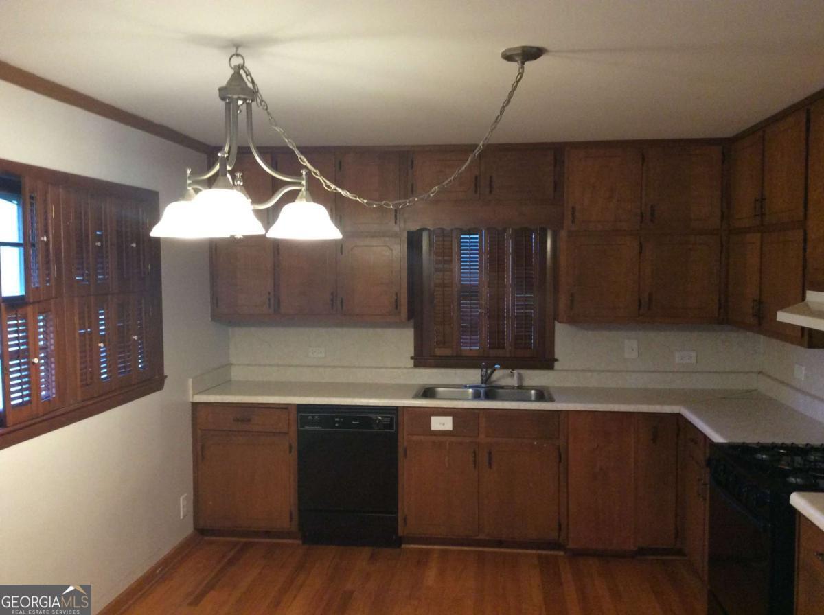 209 Decatur Road McDonough, GA 30253 - Photo 4 of 25 a kitchen with a sink a counter space and cabinets