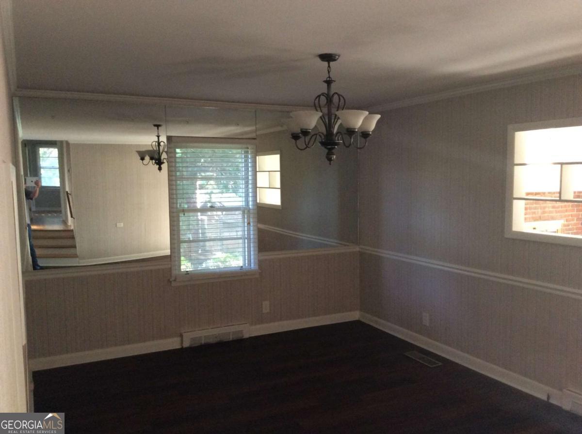 209 Decatur Road McDonough, GA 30253 - Photo 7 of 25 an empty room with wooden floor fan and window