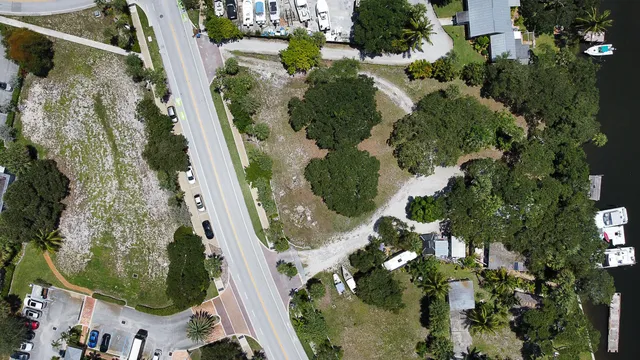 an aerial view of a residential houses with outdoor space