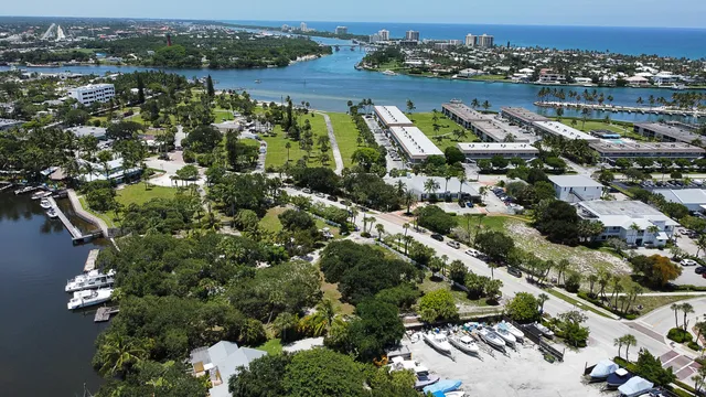 an aerial view of residential houses with yard