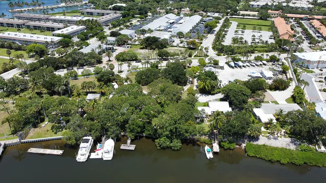 a view of a terrace with wooden floor and a yard