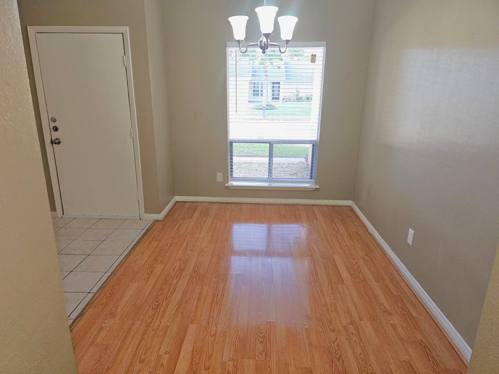 2618 Quarry Hill Road Sugar Land, TX 77478 - Photo 4 of 15 an empty room with wooden floor and windows