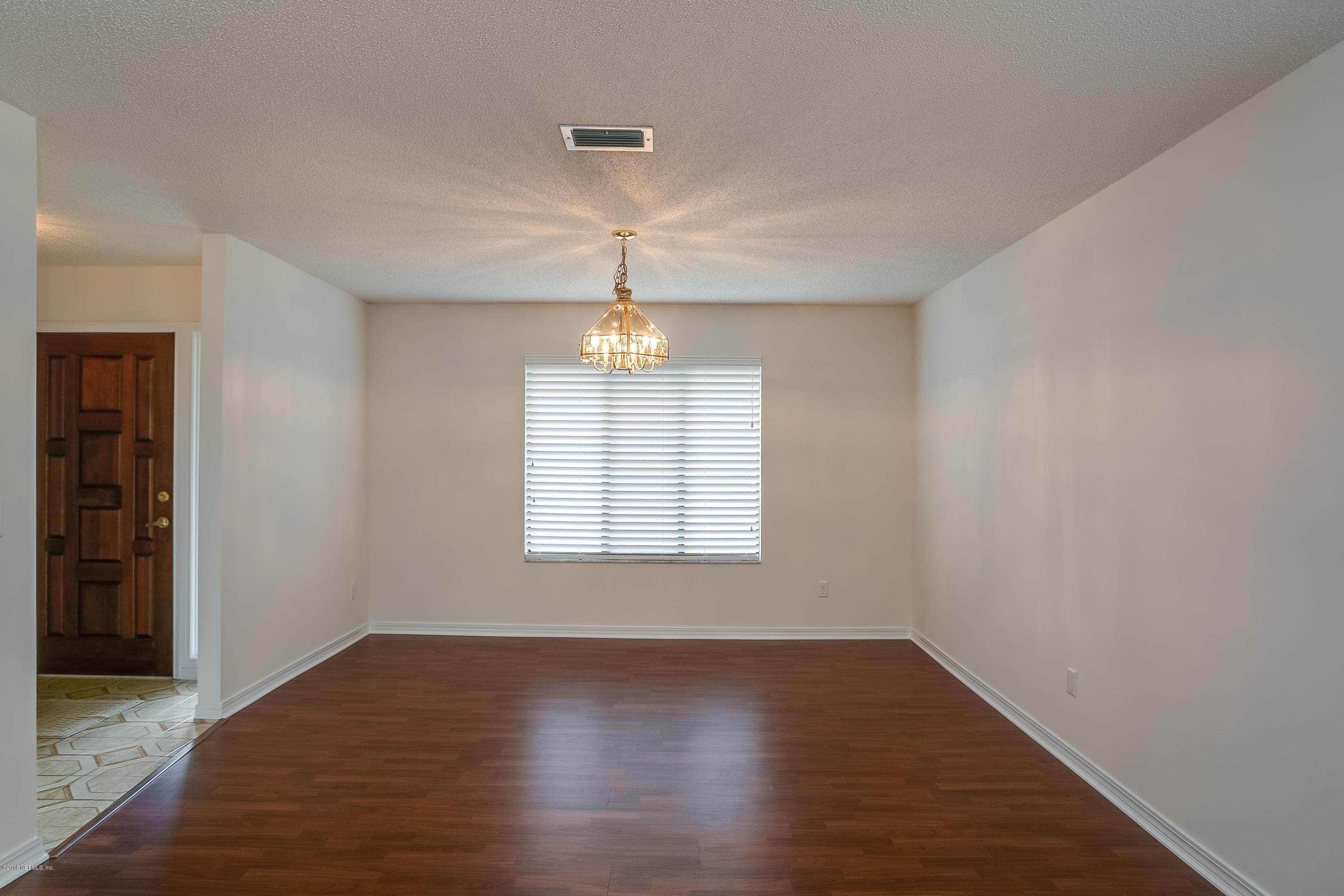 5608 Swamp Fox Road Jacksonville, FL 32210 - Photo 4 of 22 003_Living & Dining Room