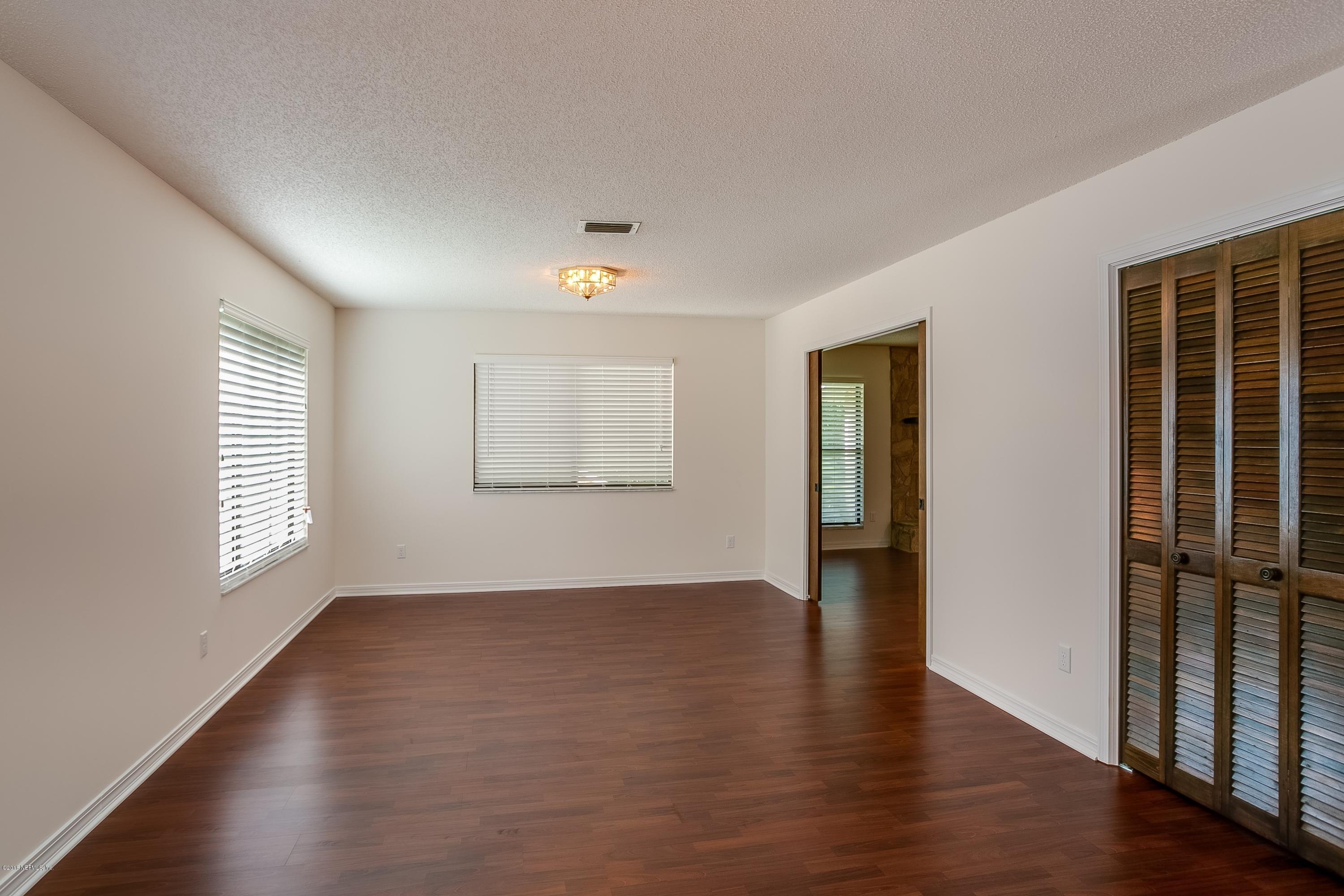5608 Swamp Fox Road Jacksonville, FL 32210 - Photo 5 of 22 004_Living & Dining Room