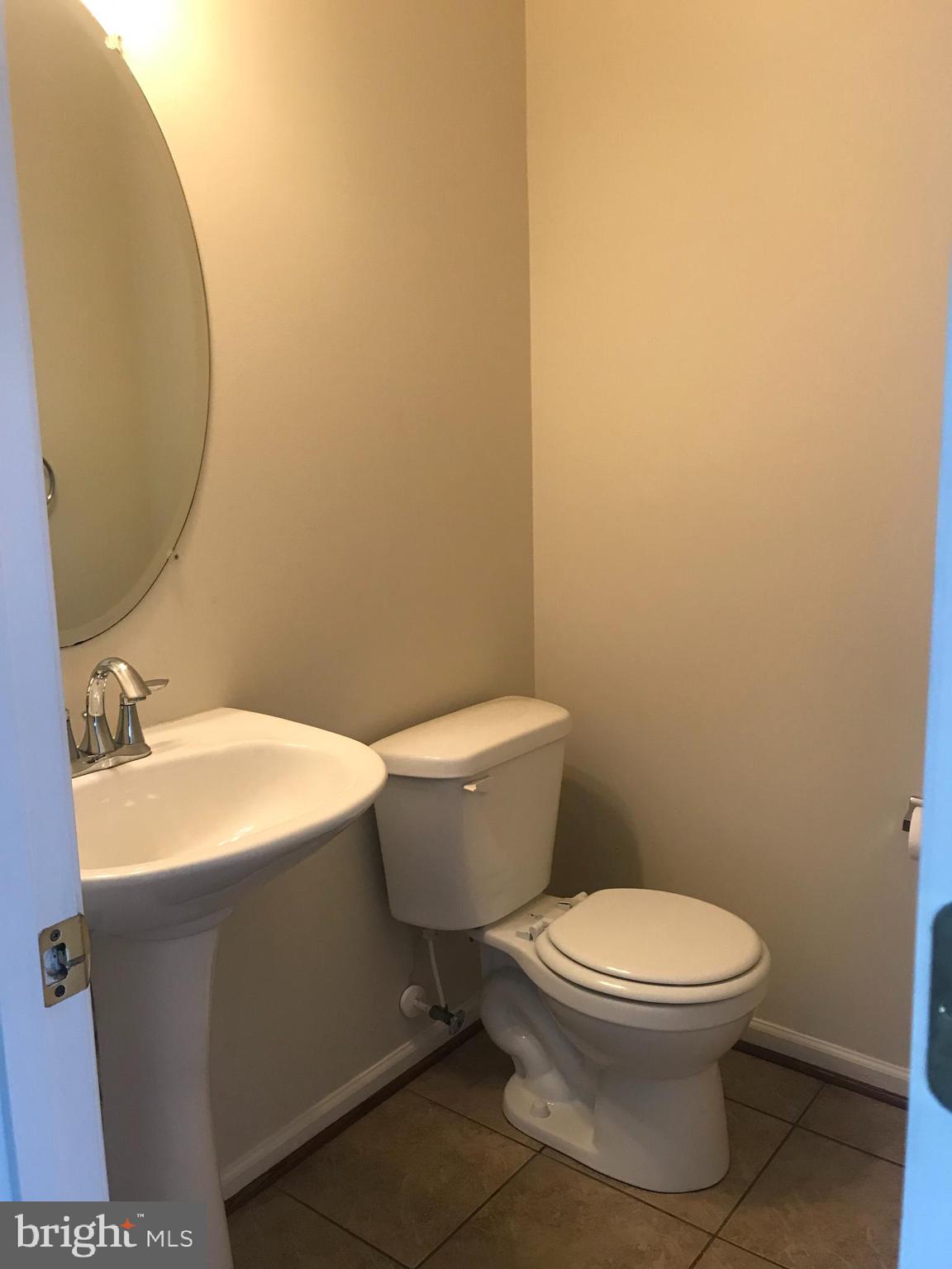 9702 Decatur Road Baltimore, MD 21220 - Photo 4 of 14 Main level half bath