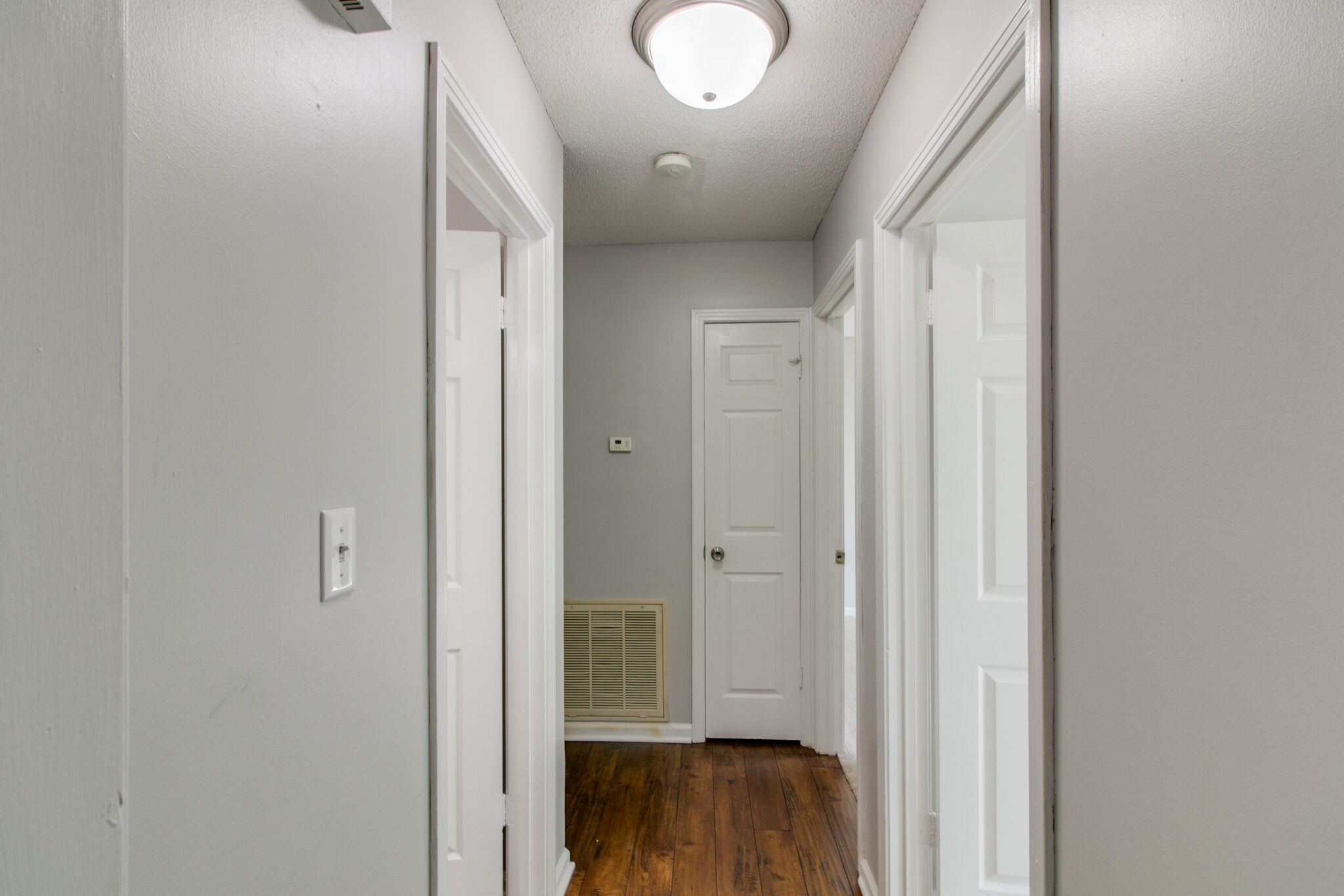 920 Dominion Drive Clarksville, TN 37042 - Photo 14 of 28 a view of a hallway with wooden floor