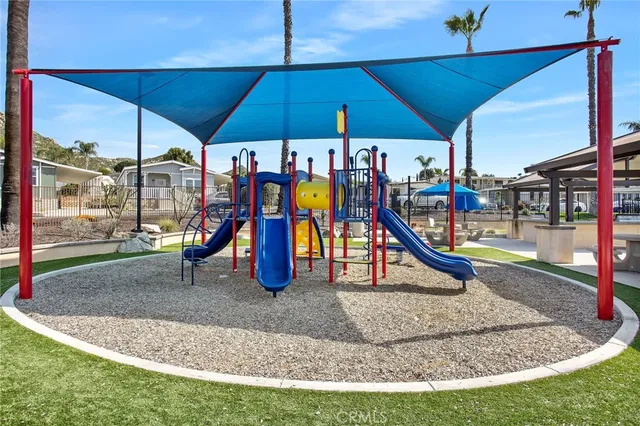 a swimming pool with outdoor seating and yard