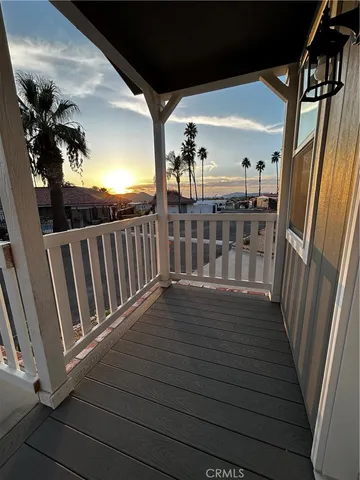 a view of balcony with wooden floor